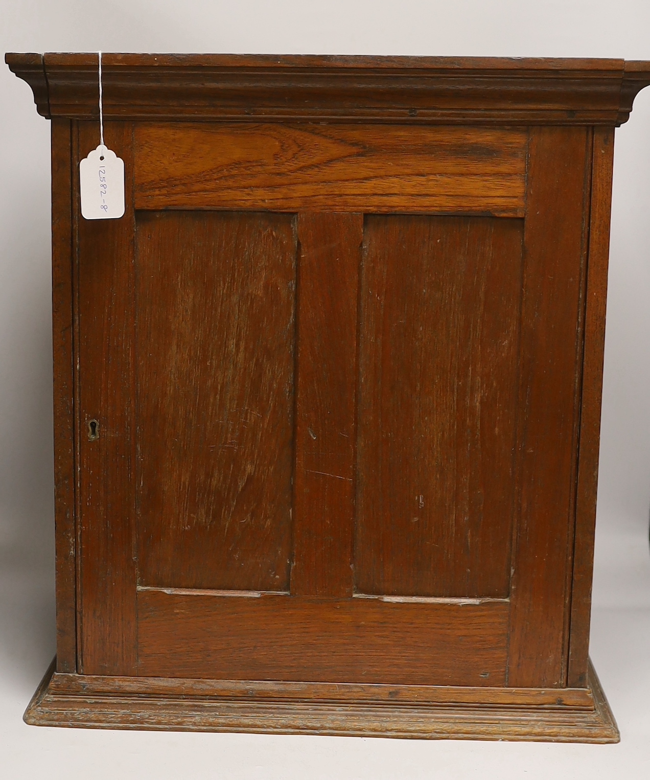 A twelve drawer mahogany collector’s cabinet with unusual sliding front cover, each shallow drawer containing two additional felt lined removable trays, possibly suitable for a coin collection, watch parts, etc. 55cm hig